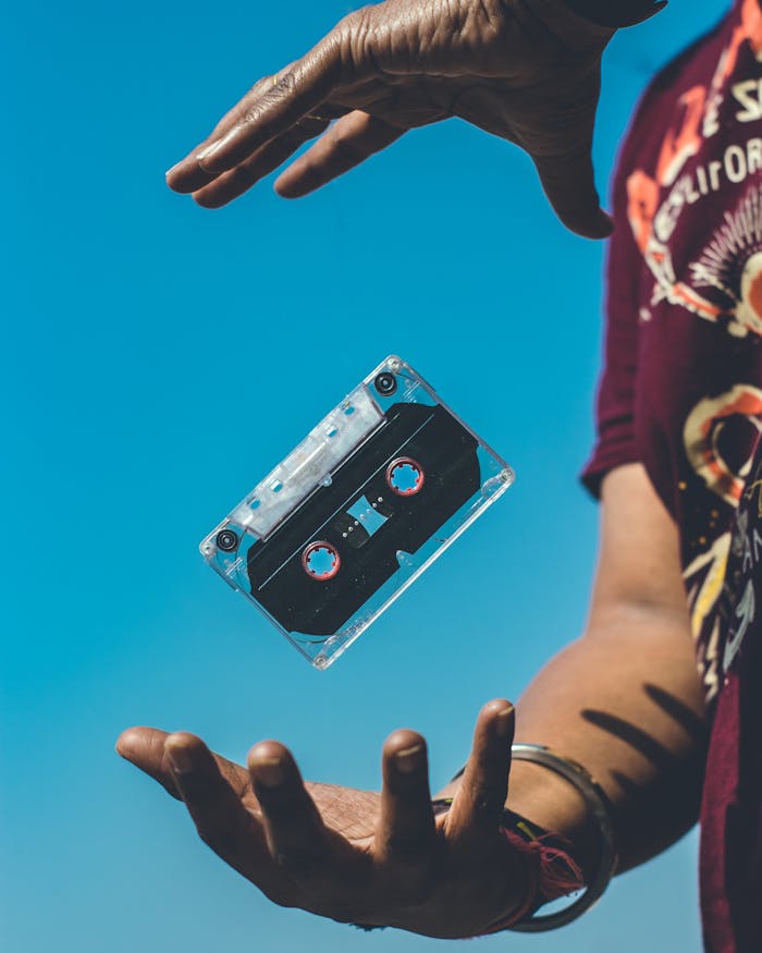 Person Doing Tricks on Cassette Tape